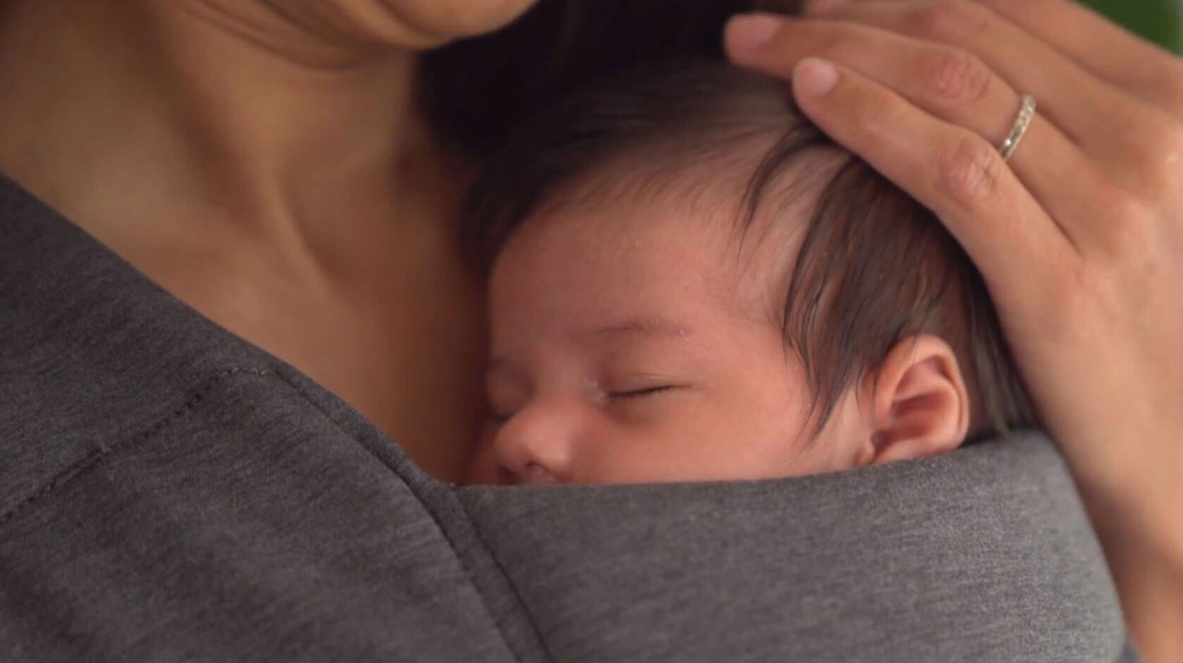 Mom with Baby in Embrace Cozy Newborn Carrier